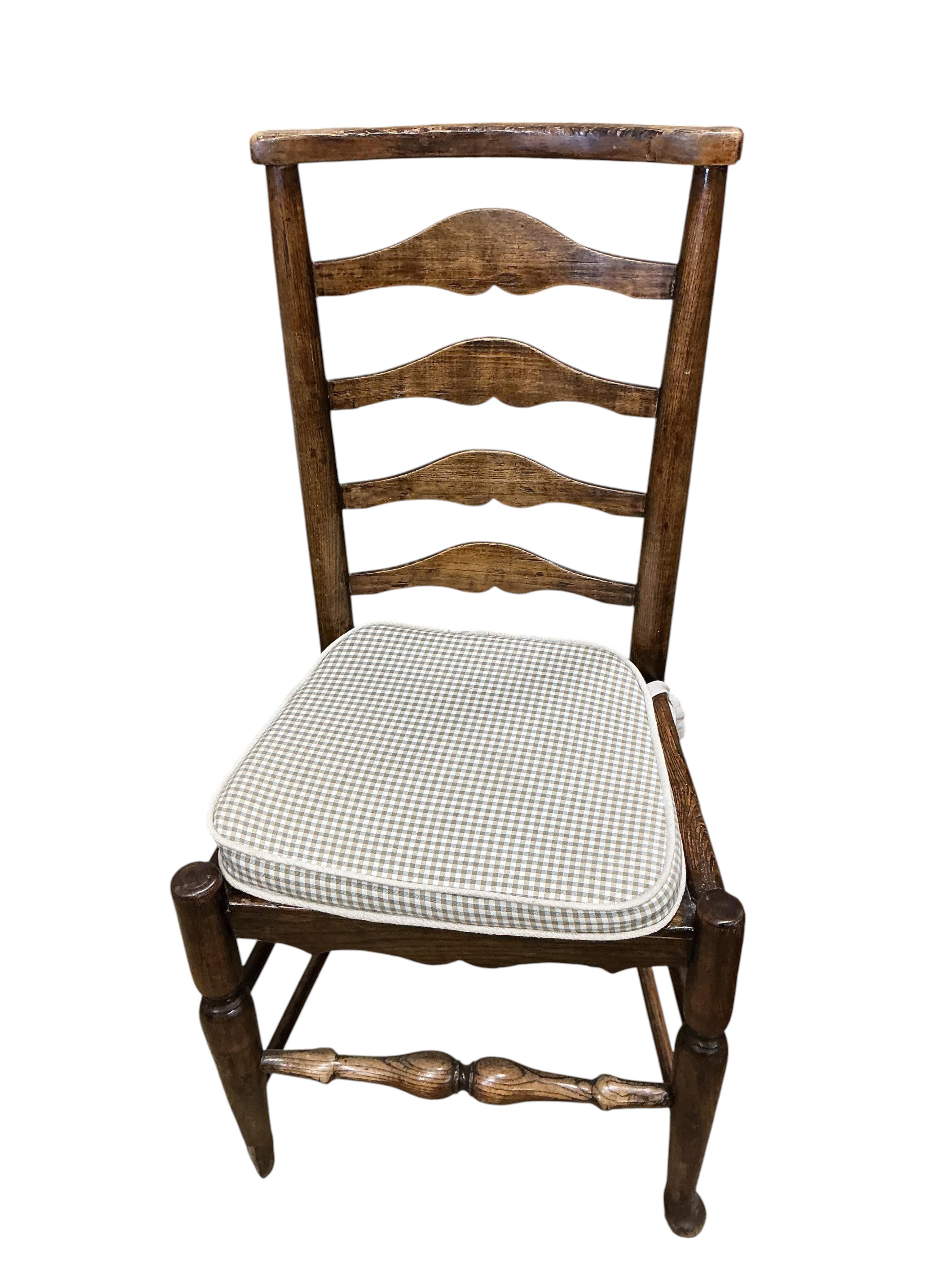 A harlequin set of six early 19th century Provincial ash and elm ladderback rush seated dining chairs (a.f.)